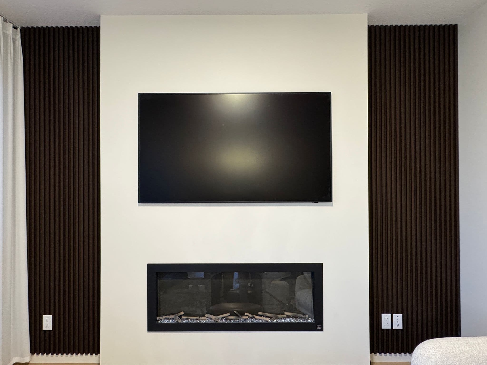 Wallpaper and slat panel combination on fireplace wall